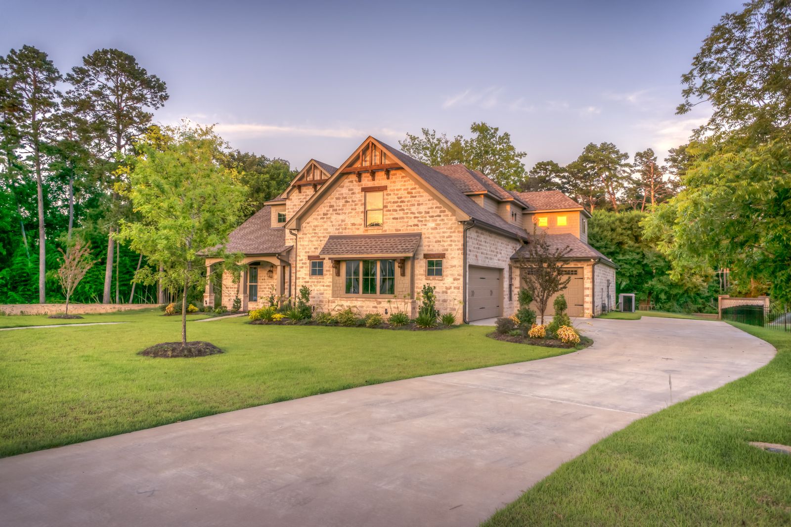 Stone home with landscaped yard
